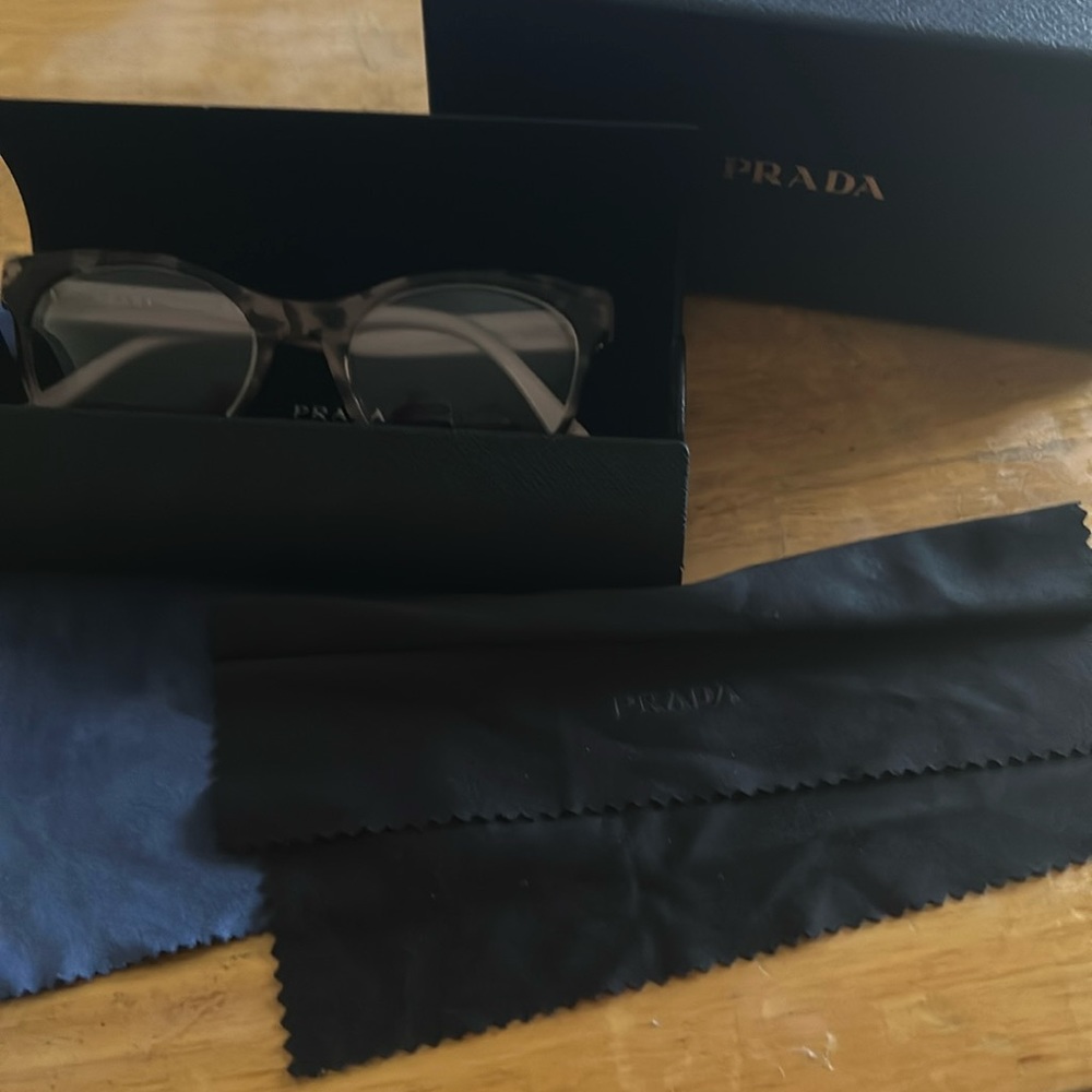 Light pink and brown Prada eyeglasses. Used but in perfect condition.